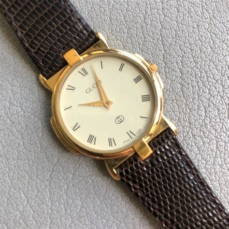 vintage gucci gold watch white face trimmed in black|authentic vintage Gucci watch.